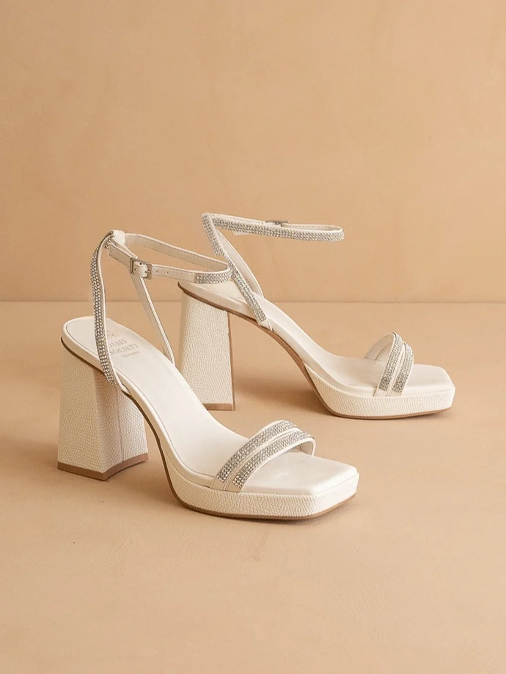 The Suva White Rhinestone and Reptile Print Strappy Block Heel by Oasis Society